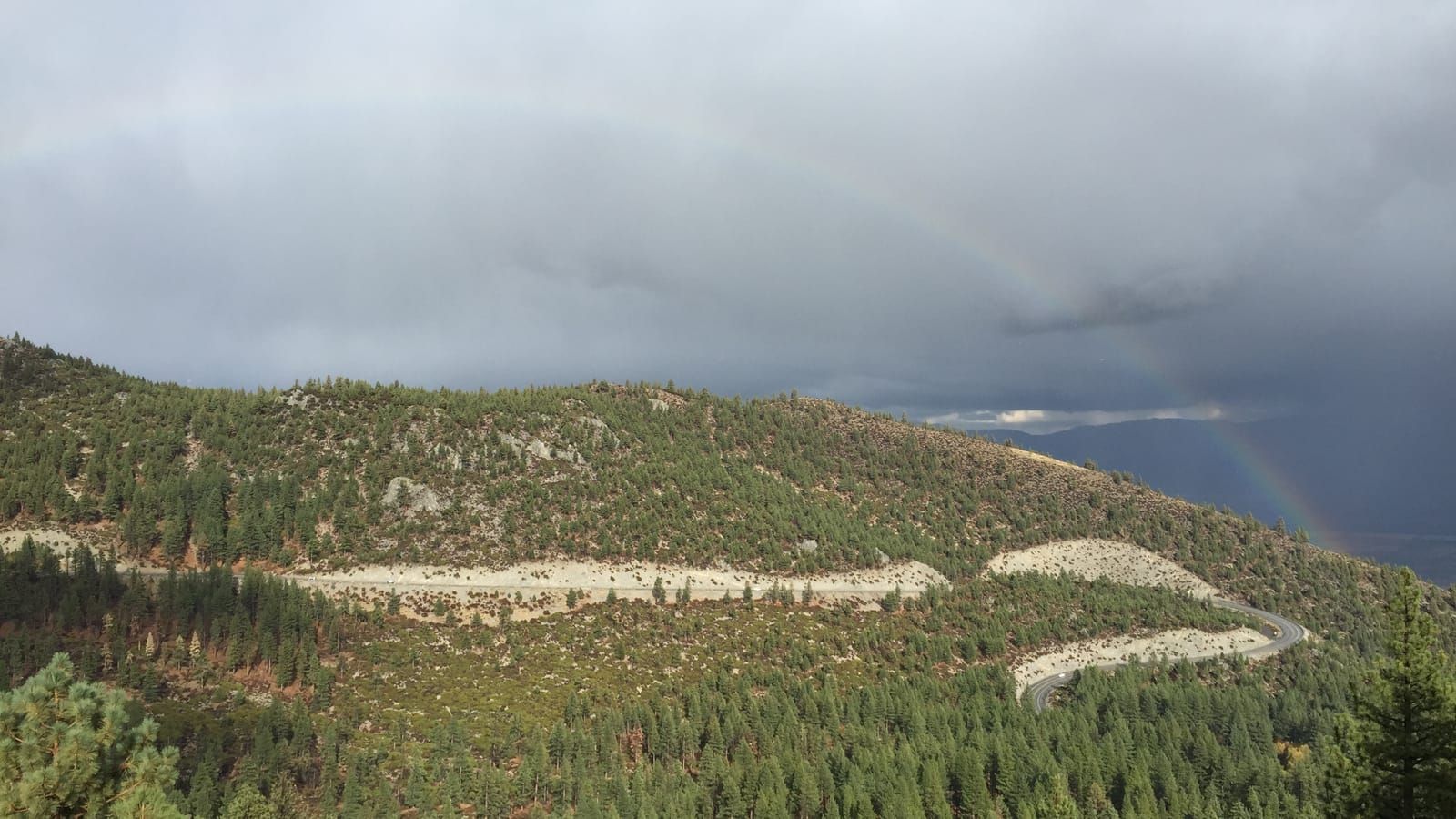 The Kingsbury Grade switchbacks under storm clouds