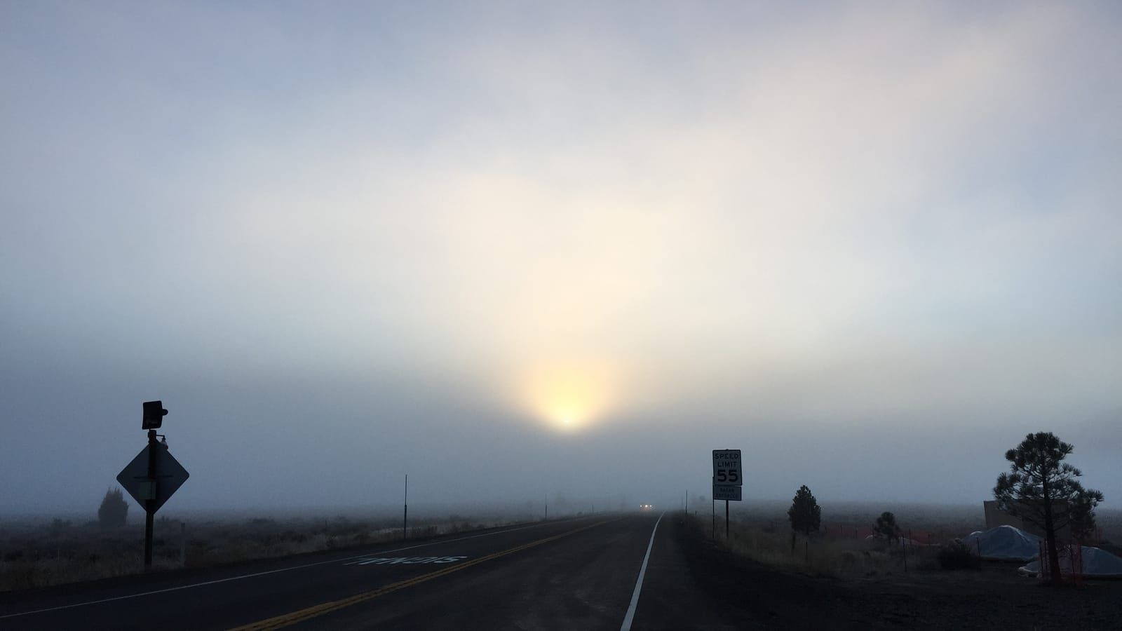 SR-267 at sunrise in fog near the Truckee Tahoe Airport
