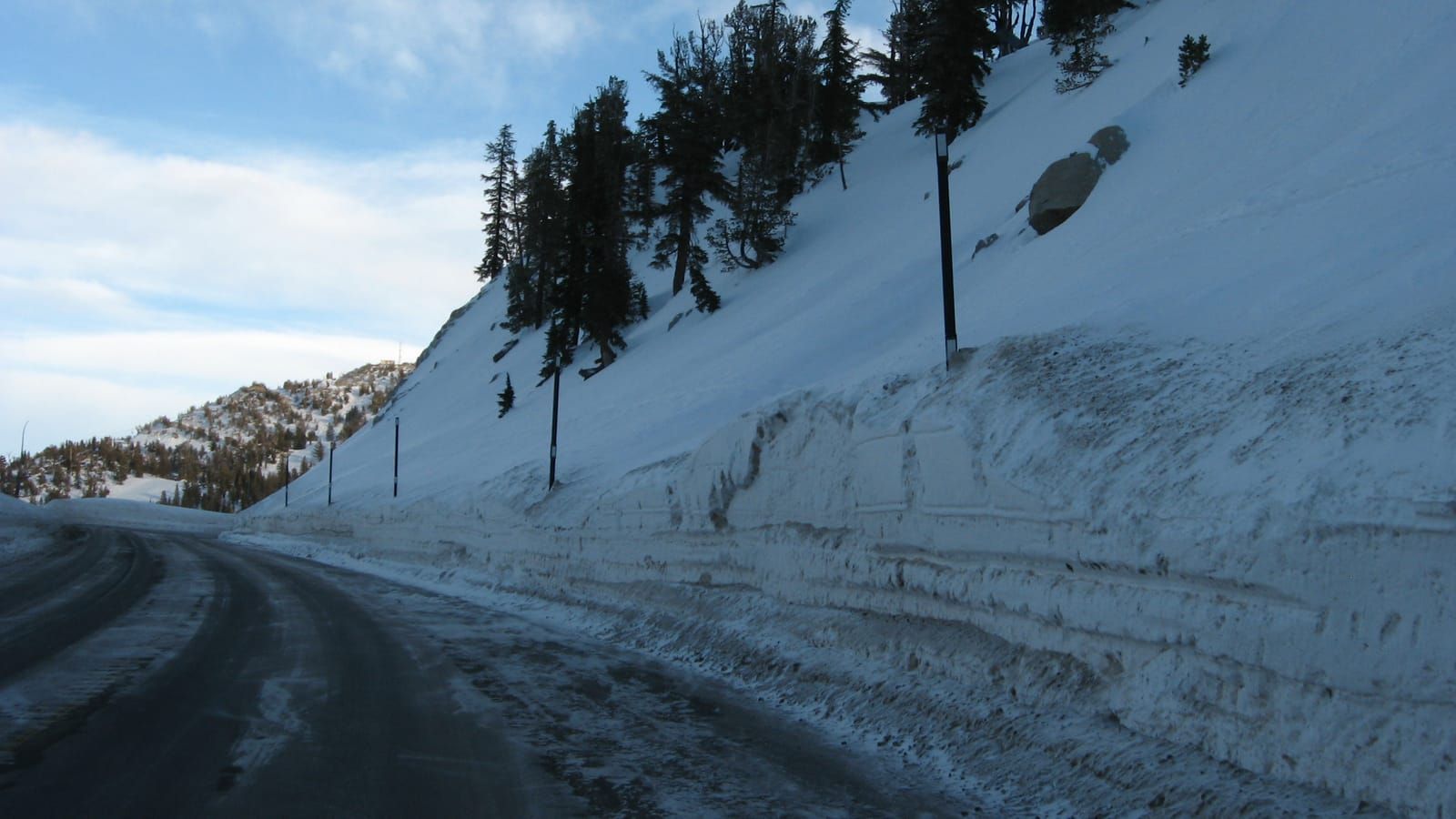 Mt Rose Highway between snowbanks on the descent toward Lake Tahoe